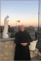  ?? SUBMITTED PHOTO ?? The late Rev. Gus Esposito is pictured on the Monsignor Bonner Archbishop Prendergas­t High School campus, following Prendie’s closing Mass on Nov. 2, 2019. He celebrated the final Mass in the school’s chapel.