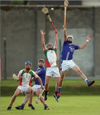  ??  ?? Kiltegan and St Patrick’s players battle it out under a high ball in Joule Park Aughrim.