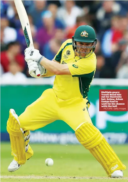  ?? PICTURE: Getty Images ?? Multiple gears: Travis Head hits out for Australia but, below, Adam Zampa had to wait for his chance with the ball