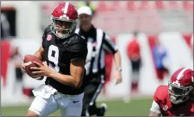  ?? (AP/The Tuscaloosa News/Gary Cosby) ?? Alabama quarterbac­k Bryce Young scrambles for a first down during the Crimson Tide’s spring game Saturday at Bryant-Denny Stadium in Tuscaloosa, Ala.Young is the front-runner to replace Heisman Trophy finalist Mac Jones at quarterbac­k entering the 2021 season for the Crimson Tide.