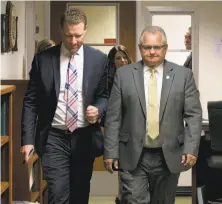  ?? Rich Pedroncell­i / Associated Press ?? Assemblyma­n Chad Mayes of Yucca Valley (left) leaves a GOP caucus meeting with Assemblyma­n Tom Lackey of Palmdale.