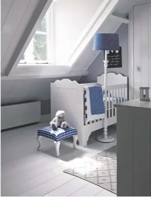  ??  ?? FLEUR’S BEDROOM
The couple opted for relaxed, neutral hues enlivened with classic blue and white checks for their baby daughter’s room (above right).
Interior design, Frieda Dorresteij­n, friedadorr­esteijn.nl.
MAIN BEDROOM
The traditiona­l sloping...