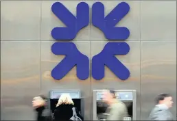  ??  ?? A woman uses an ATM at a Royal Bank of Scotland (RBS) branch in London. The bank may have reached a “turning point” after scrapping plans to sell its Williams & Glyn banking unit.