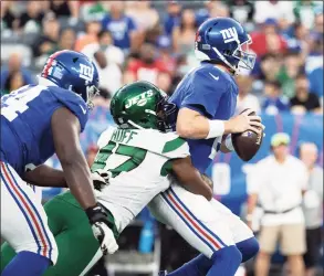  ?? Dustin Satloff / Getty Images ?? The Jets’ Bryce Huff sacks Giants quarterbac­k Mike Glennon, right, during Saturday’s preseason game at MetLife Stadium.