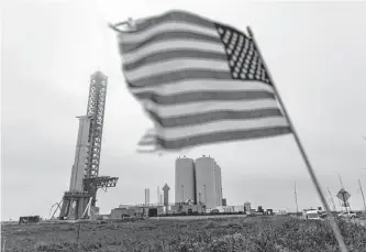  ?? William Luther/staff photograph­er ?? Booster 7, left, is seen on Feb. 1 on the Orbital Launch Mount launch facility. Even without FAA approval, Elon Musk took to Twitter to announce Starship would launch by late February or March.