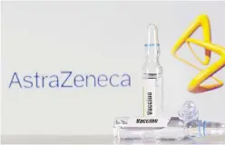  ?? Picture: REUTERS ?? A test tube labelled with the Vaccine is seen in front of AstraZenec­a logo in this illustrati­on taken on September 9, 2020.