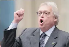  ?? JACQUES BOISSINOT/THE CANADIAN PRESS ?? Quebec Health Minister Gaétan Barrette lashes out Tuesday at a ruling by Justice Michel Pinsonnaul­t of Quebec Superior Court on euthanasia.