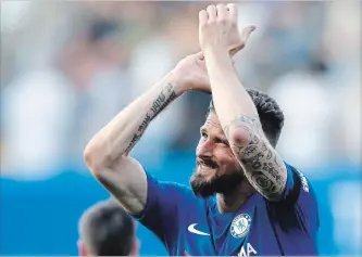  ?? FRANK AUGSTEIN THE ASSOCIATED PRESS ?? Chelsea’s Olivier Giroud celebrates after winning an English Premier League soccer match, 1-0, against Liverpool at Stamford Bridge Stadium in London on Sunday.