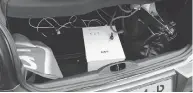  ?? DUTCH DEFENSE MINISTRY VIA AP ?? A photograph released by the Dutch Ministry of Defence shows a rental vehicle’s trunk loaded with a computer, battery and a white transforme­r.