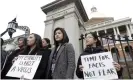  ?? Photograph: Steven Senne/AP ?? Jessica Wong, front left, Jenny Chiang, center, and Sheila Vo from the Massachuse­tts’ Asian American Commission, stand together during a protest on 12 March.