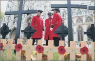  ?? PICTURE: GARETH FULLER/PA WIRE. ?? MEMORIAL: Chelsea Pensioners amongst remembranc­e crosses in the Westminste­r Abbey Field of Remembranc­e.