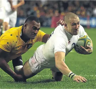  ??  ?? ■
Mike Brown goes over for England’s second try yesterday.