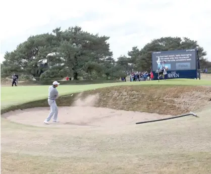  ?? AP ?? Tiger Woods plays out of a bunker on the 13th hole during a practice round Wednesday for the British Open at Carnoustie.