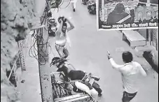  ??  ?? A video grab shows an armed man opening fire at a 54-year-old man in northeast Delhi’s Brahmpuri on Thursday.