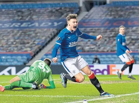  ??  ?? RAW EMOTION: 19-year-old Nathan Patterson celebrates his first goal for Rangers to make it 2-1 at Ibrox last night.