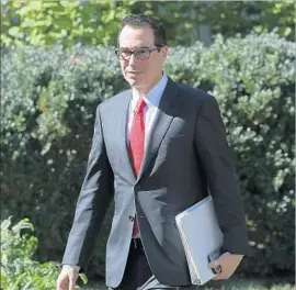  ?? Chip Somodevill­a Getty Images ?? TREASURY Secretary Steven T. Mnuchin gave his “absolute guarantee” that Congress would send a tax bill to Trump to sign by the end of the year.