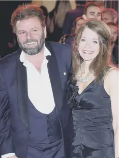  ??  ?? 0 Homes Under The Hammer’s Martin Roberts with wife Kirsty