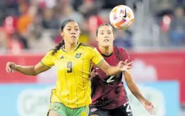  ?? AP ?? Canada’s Sydney Collins (2) battles with Jamaica’s Kameron Simmonds (9) for the ball during the first half of a CONCACAF Women’s Championsh­ip game in Toronto on September 26, 2023.