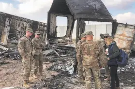  ?? Qassim Abdul-Zahra / Associated Press 2020 ?? U.S. soldiers assess damage at Ain alAsad air base in 2020 after an Iranian bombing. It is one of the last remaining Iraqi bases with American forces.