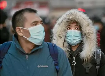  ??  ?? Passengers in Beijing wait to board trains for the start of new year festivitie­s, as China tries to
prevent the spread of the
latest virus.
GETTY