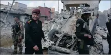  ?? PICTURE: REUTERS ?? Major-General Abdul Ghani al-Asadi, a commander of the Counter Terrorism Service, at a Mosul site after an air strike attack against Islamic State triggered a blast yesterday.