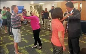  ?? KATHLEEN CAREY — DIGITAL FIRST MEDIA ?? Educators and others work on their self-defense moves during the school-safety seminar.