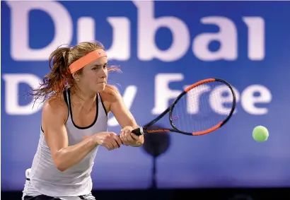  ?? Getty file ?? Elina Svitolina plays a backhand during her final against Caroline Woznacki in the WTA DDF Tennis Championsh­ip 2017. —