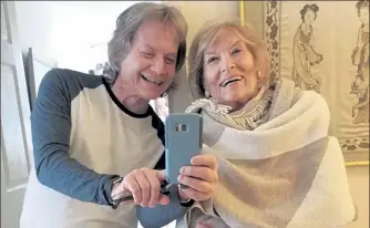  ?? COURTESY LELAND STEIN VIA AP ?? Leland Stein, left, takes a photo with his mother Sondra Green in her apartment in New York on April 26, 2018. The two are reuniting in person for Mother’s Day as vaccinatio­ns have made families feel more comfortabl­e gathering for the holiday.