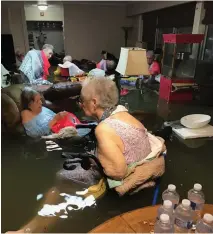  ??  ?? TEXAS Damage from Hurricane Harvey in 2017 forced these nursing-home residents to wait for help in flood waters that had risen to waist levels.