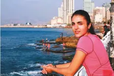  ?? AFP ?? Nour Safie Al Deen, 24, warms up before jogging along the seafront in the Lebanese capital of Beirut.