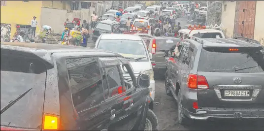  ?? Moses Sawasawa The Associated Press ?? Traffic clogs a main road Thursday as residents try to flee Goma, Congo, five days after Mount Nyiragongo erupted.