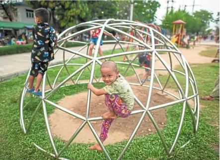  ?? — afp ?? Sweet escape: Children playing at a park during an electricit­y blackout in yangon.