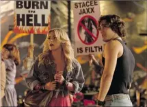  ?? Courtesy, Warner Bros. Pictures ?? From left, Julianne Hough and Diego Boneta in Rock of Ages. The tongue-in-cheek film has an emotionall­y manipulati­ve soundtrack.