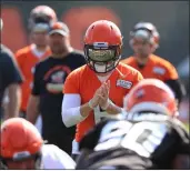  ?? TIM PHILLIS — FOR THE NEWS-HERALD ?? Baker Mayfield prepares for a snap during practice Aug. 21 in Berea.