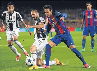 ?? Picture: Getty Images. ?? Juventus defender Giorgio Chiellini holds off Barcelona’s Neymar.