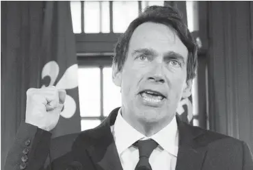  ?? GRAHAM HUGHES/ THE CANADIAN PRESS ?? Pierre Karl Péladeau’s fist pump in support of marching toward sovereignt­y has been one of two indelible images of the campaign, writes L. Ian MacDonald, the other being “le shove,” when Marois pushed Péladeau away from the podium.