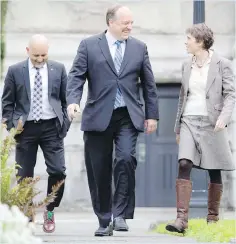  ?? DARREN STONE, TIMES COLONIST ?? Two new Island Green MLAs — Adam Olsen, left, winner in Saanich North and the Islands, and Sonia Furstenau, winner in Cowichan Valley — flank B.C. Green Party Leader Andrew Weaver at the legislatur­e on Wednesday.