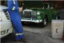  ?? Photograph: Cooper Neill/The Guardian ?? Patrick spends his time working on his Kelly green 1955 Chevy two-door Post.