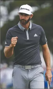  ?? The Associated Press ?? ON THE GREEN: Dustin Johnson reacts after making a putt for birdie on the fourth green during the second round of the U.S. Open Golf Championsh­ip Friday in Southampto­n, N.Y.