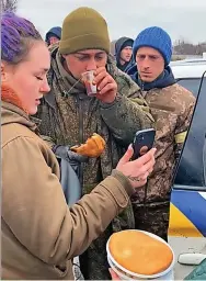  ?? ?? Call... Ukrainians help Russian soldier phone mum