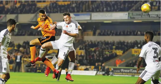  ?? PICTURES: Action Images ?? ROMAIN EMPIRE: Romain Saiss scores’ Wolves first goal against Fulham on Friday night