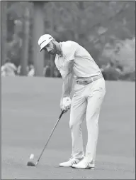  ?? Associated Press ?? On the mend: Dustin Johnson hits on the 13th hole during a practice round for the Masters golf tournament last week in Augusta, Ga. After withdrawin­g from the Masters due to a back injury, Johnson is beginning to prepare for the Wells Fargo...