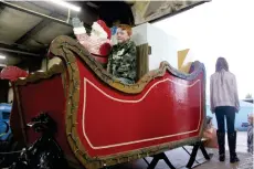  ?? (Matt Hutcheson/News-Times) ?? Union County’s grand marshal float is one of many currently being prepped for tonight’s annual Christmas parade.