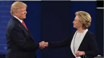  ?? ROBYN BECK/AFP/GETTY IMAGES ?? Donald Trump lost the second debate by behaving like a bully. Hillary Clinton was calm, but looked uncomforta­ble.