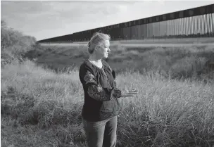  ?? ERIC GAY/ASSOCIATED PRESS ?? Marianna Trevino Wright, executive director of the National Butterfly Center, talks last month about how the new border wall being built in Mission, Texas, will affect wildlife. President-elect Joe Biden will inherit a massive wall-building effort that accelerate­d in President Donald Trump’s final year. Almost all of the constructi­on under Trump has taken place in wildlife refuges and Indigenous territory that already belongs to the U.S. government.