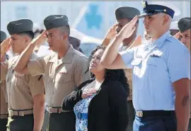  ?? Nelvin C. Cepeda San Diego Union-Tribune ?? VIRGINIA LOPEZ COLEMAN, whose husband is an Army veteran and whose daughter serves in the Army in Hawaii, takes the oath to become a U.S. citizen.