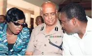  ?? JERMAINE BARNABY/PHOTOGRAPH­ER ?? Robert Montague (right), minister of national security, in discussion with Novelette Grant (left), deputy commission­er of police, and George Quallo, commission­er of police, at Andrews Memorial Seventh-day Adventist Church on Hope Road, St Andrew,...