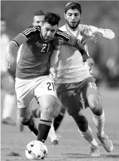  ??  ?? Egypt’s Mahmoud Hassan (left) and Tunisia’s Ferjani Sassi in action during an internatio­nal iriendly iatch at Cairo Stadium in Egypt in this Jan 8 file photo. — Reuters photo