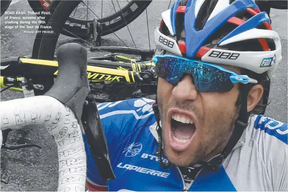  ?? Picture: JEFF PACOUD ?? ROAD RASH: Thibaut Pinot, of France, screams after crashing during the fifth stage of the Tour de France.