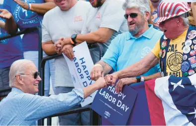  ?? MATT ROURKE/AP ?? President Joe Biden greets supporters on Labor Day, Sept. 4, at the Sheet Metal Workers Local 19 in Philadelph­ia.